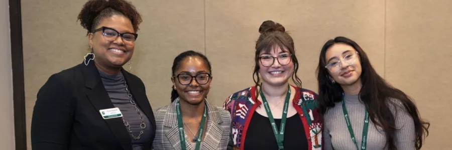 Niner Finances students smiling at a symposium