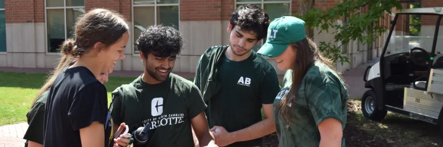 Students looking down at a paper while participating in Norms Quest